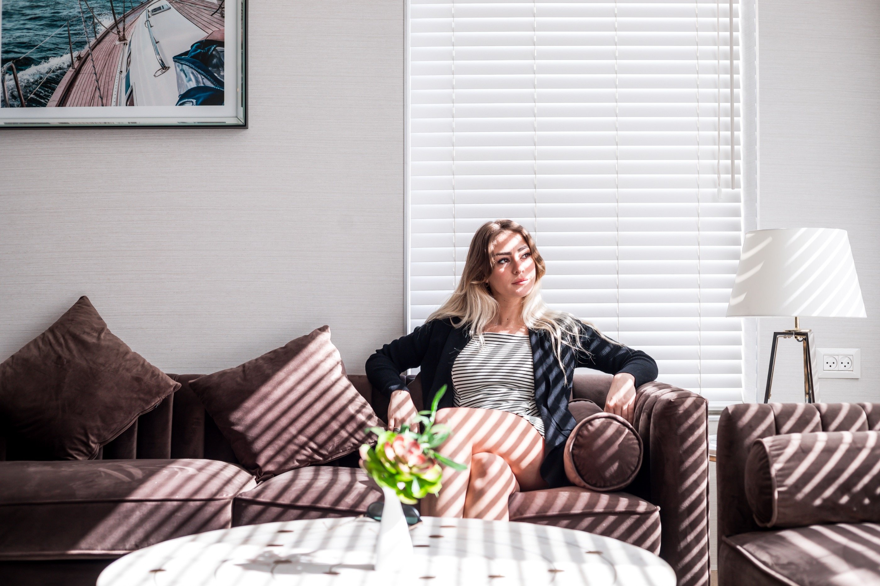 Venetian light across a velvet suite.