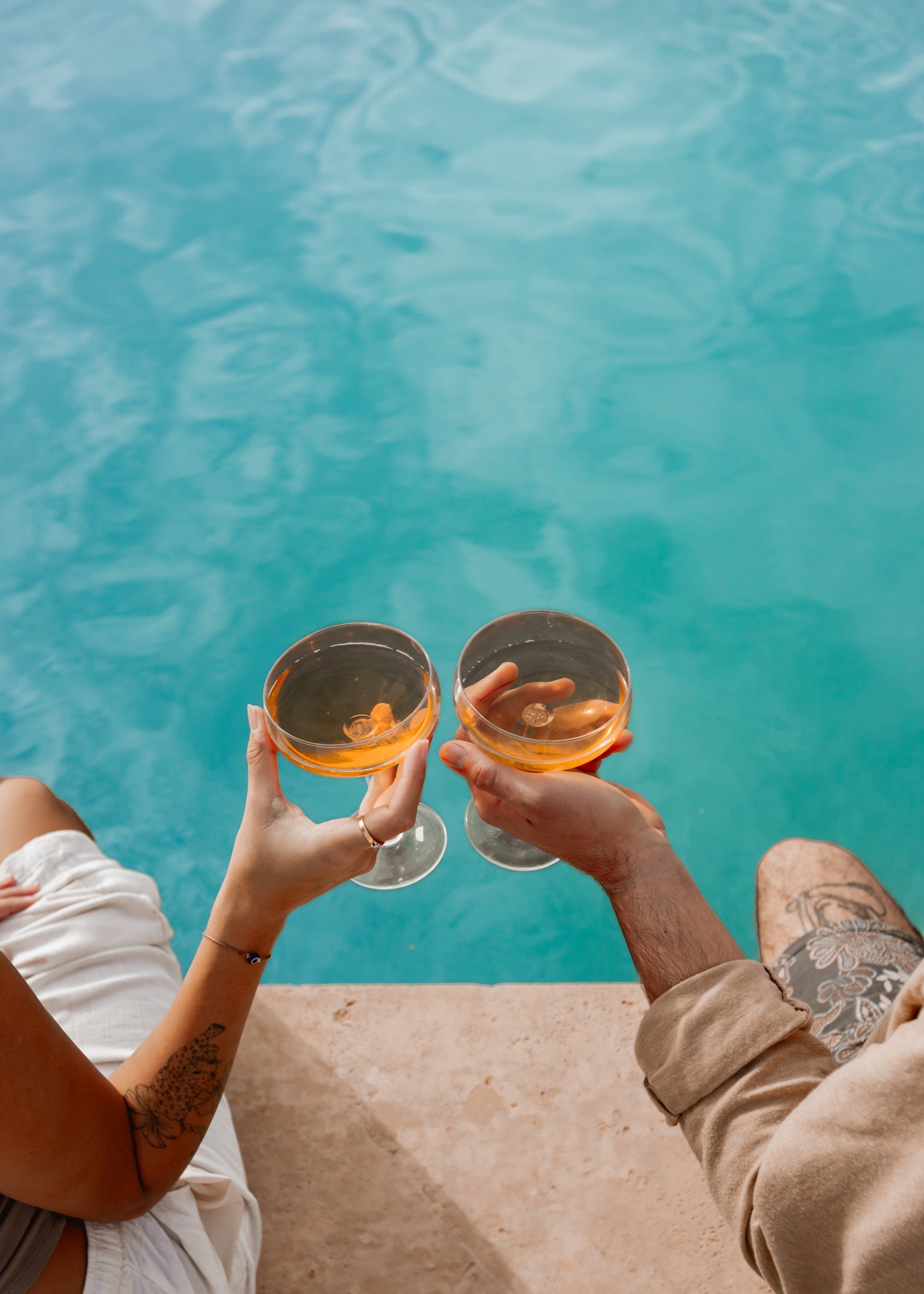 Cheers, over the pool.