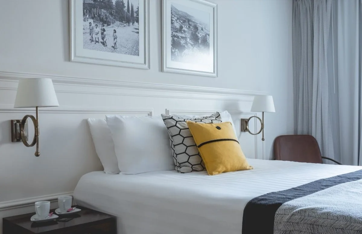 Two prints, a yellow pillow, enough.