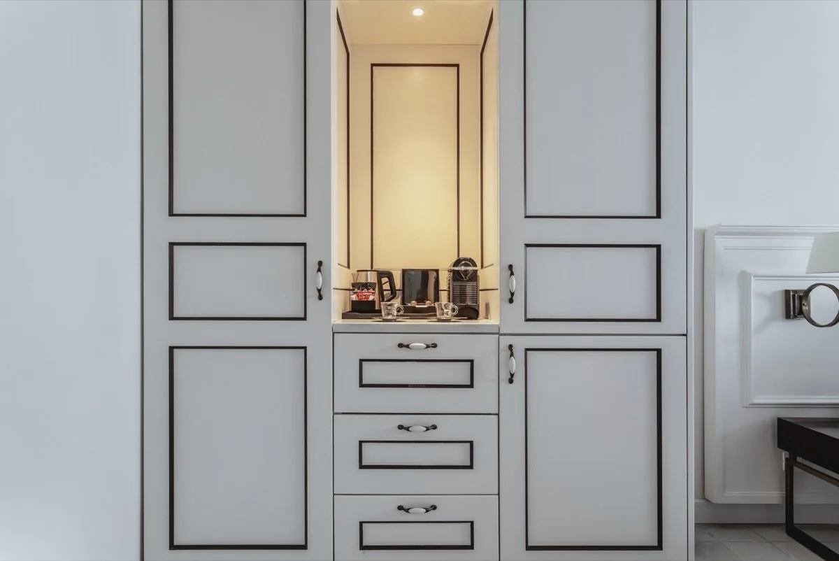 A quiet cabinet — the room's last detail.
