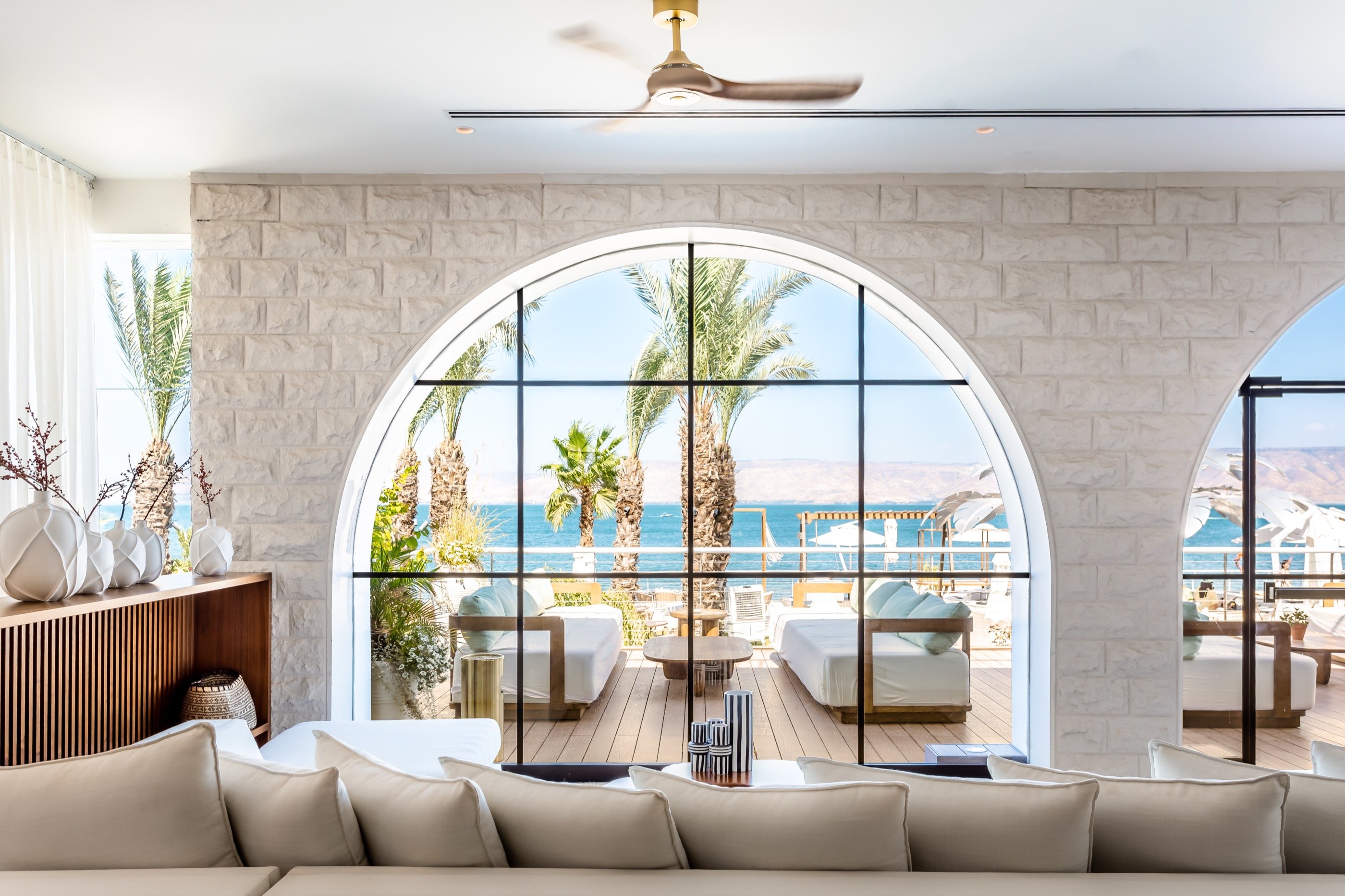 A single arch frames the sea.