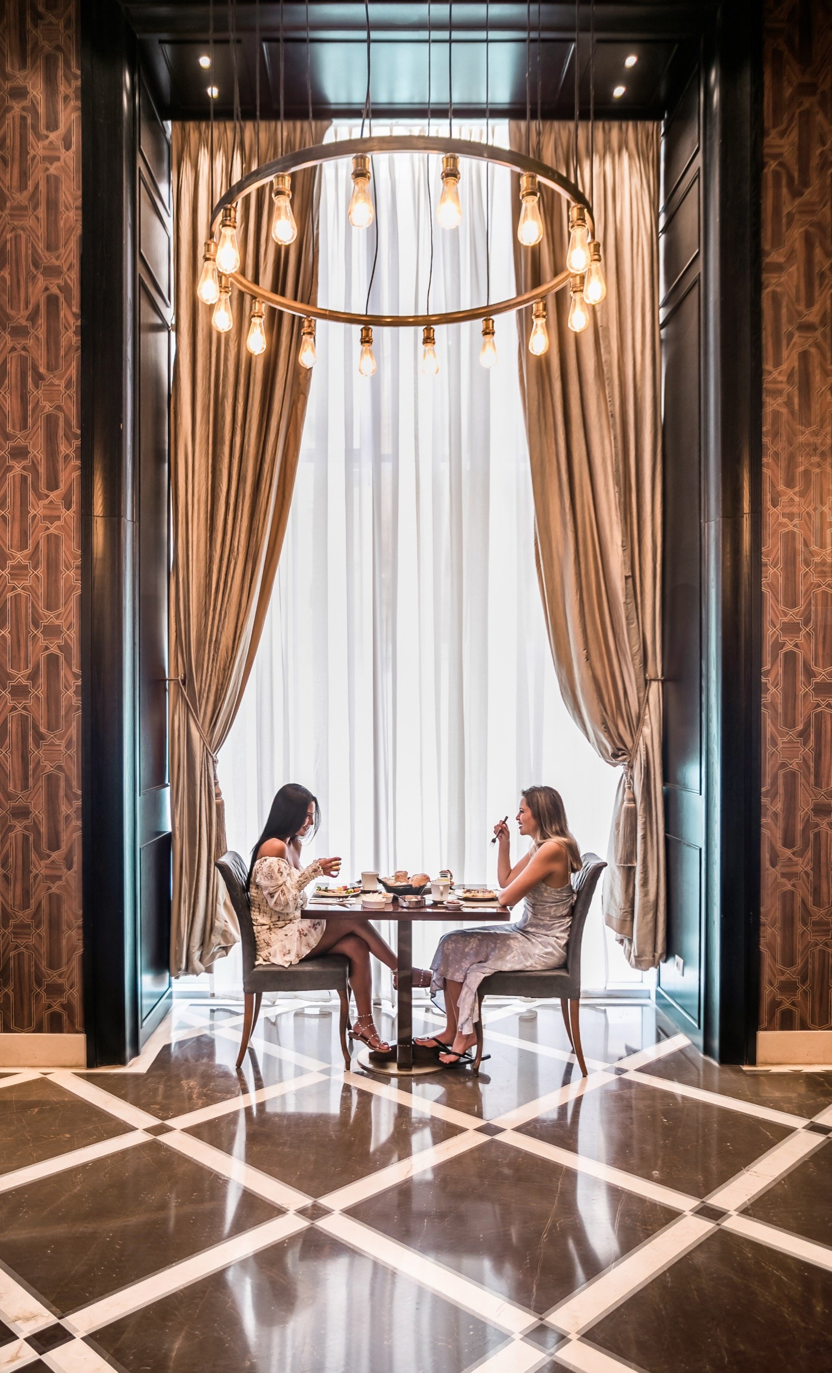 A private table, framed by its own light.
