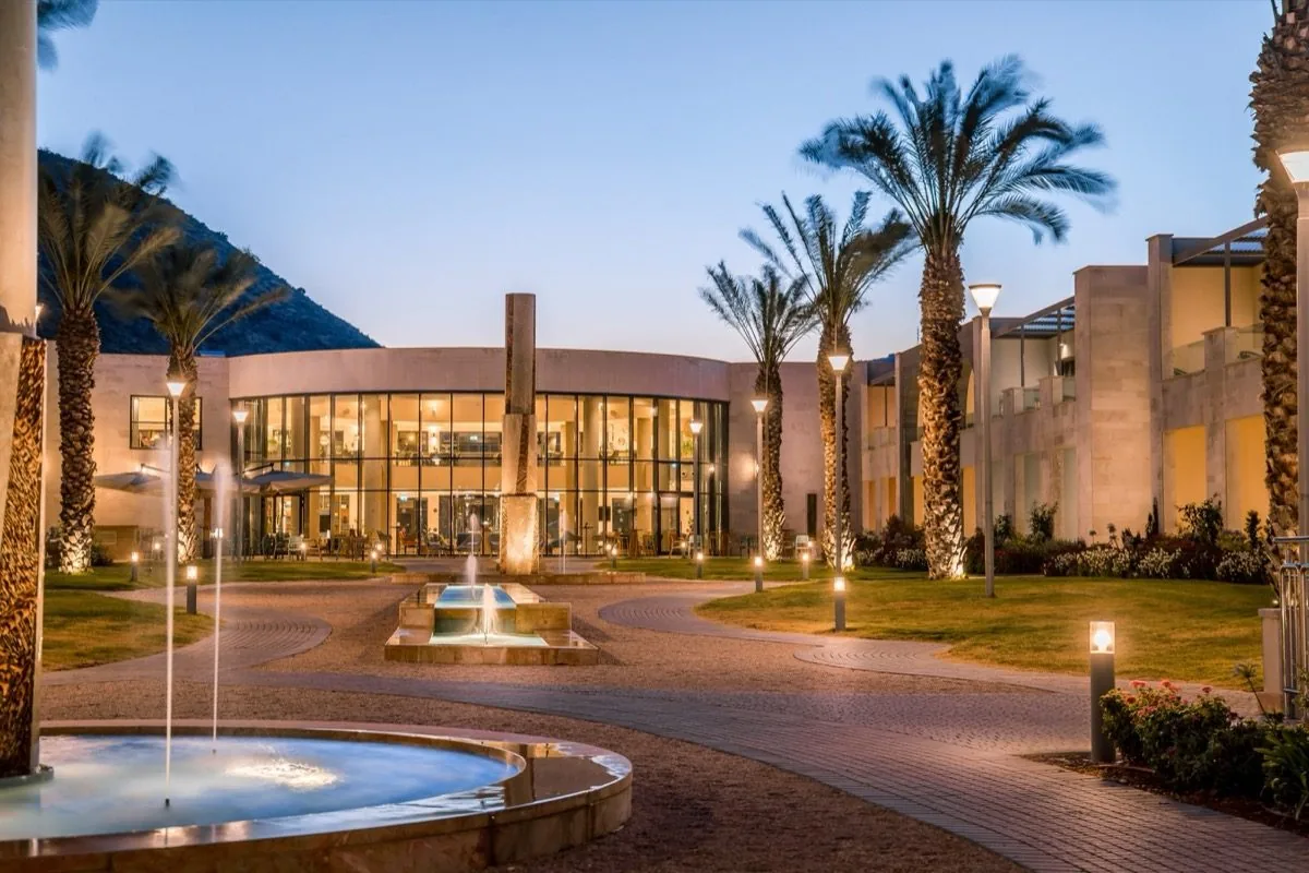 The courtyard breathes at dusk.