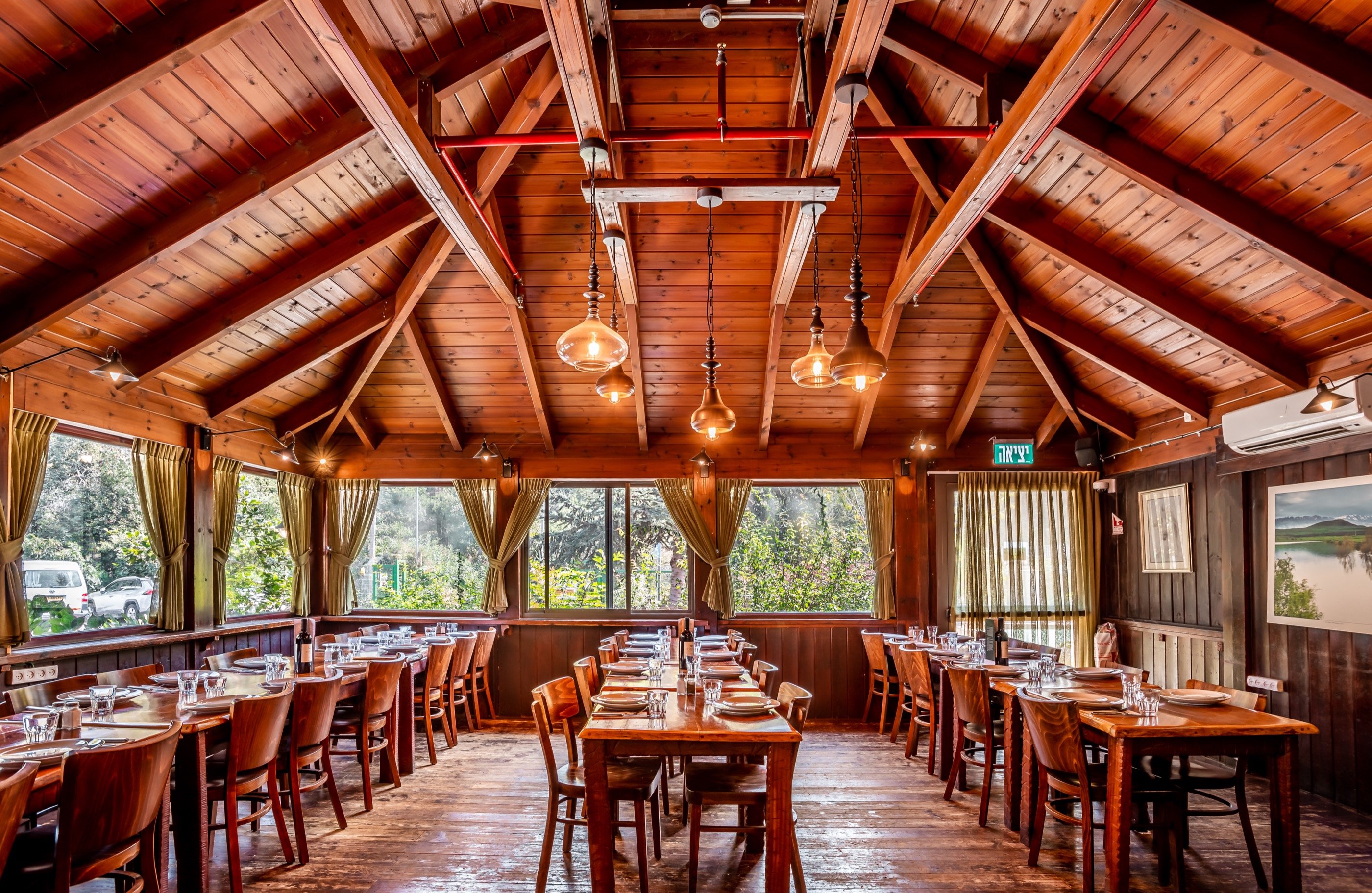 The wooden dining hall — rafters over long tables.