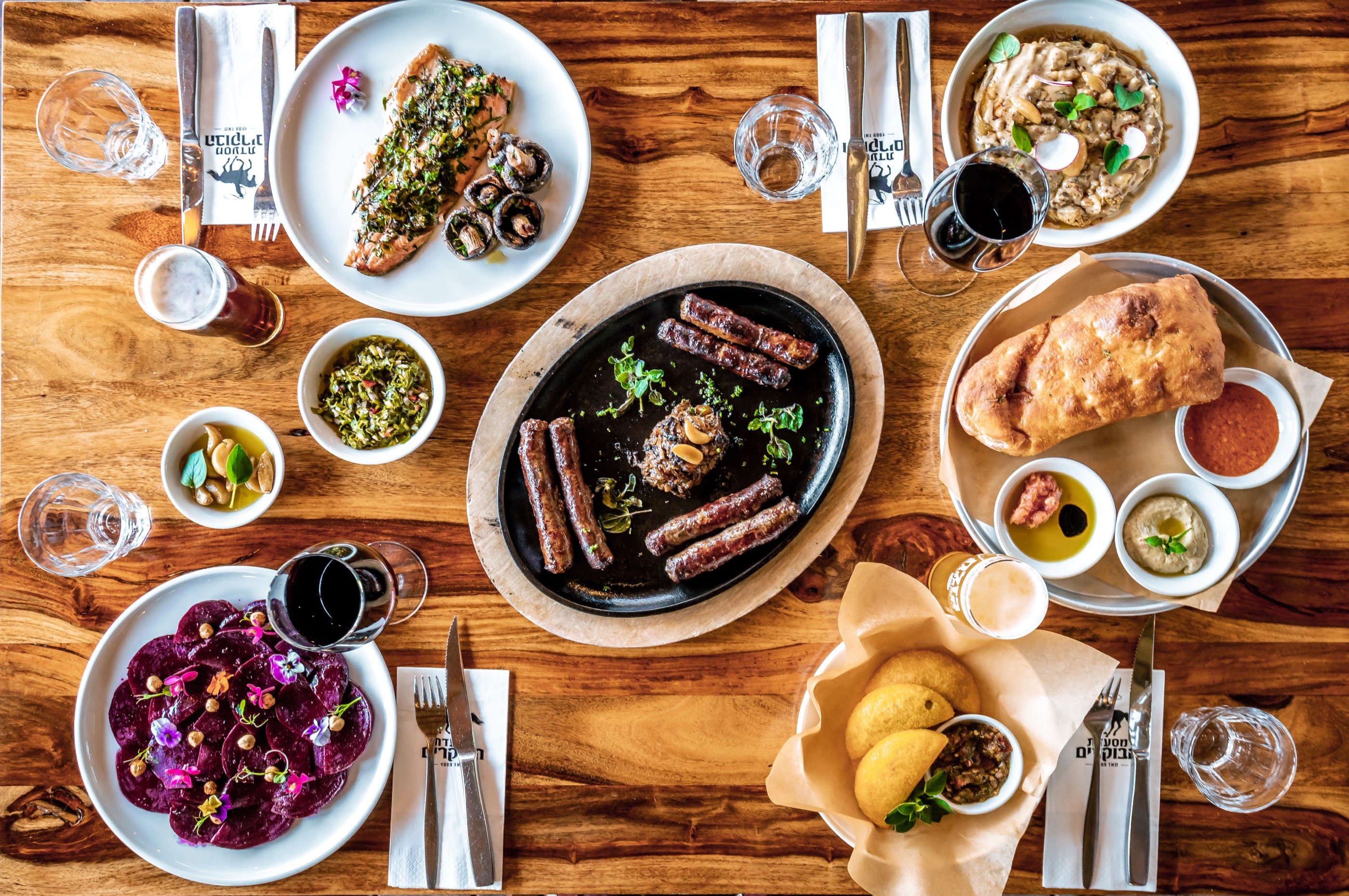 Top-down — one long table, many plates.