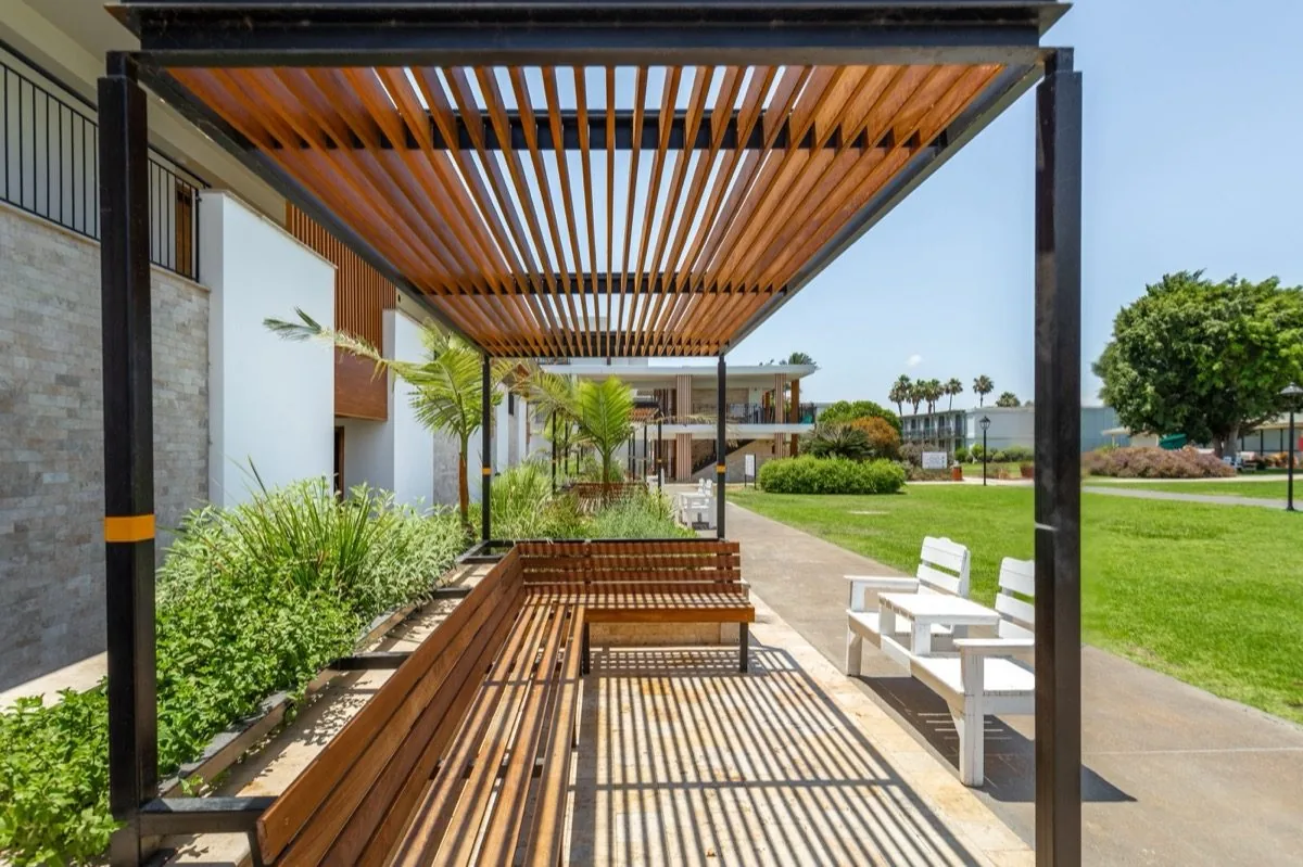 A slatted pergola — the quiet hour.