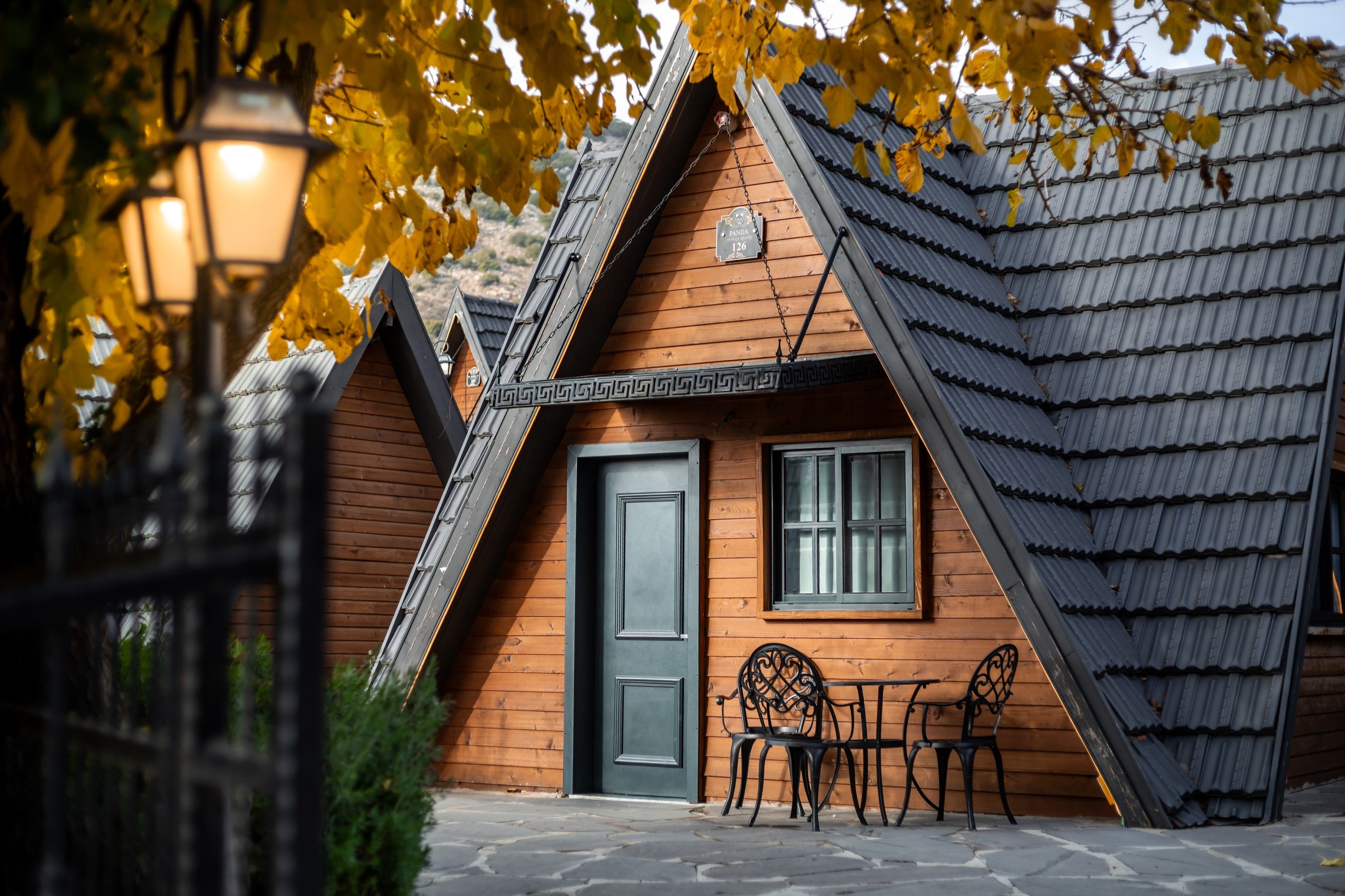 The same cabin, autumn leaves.