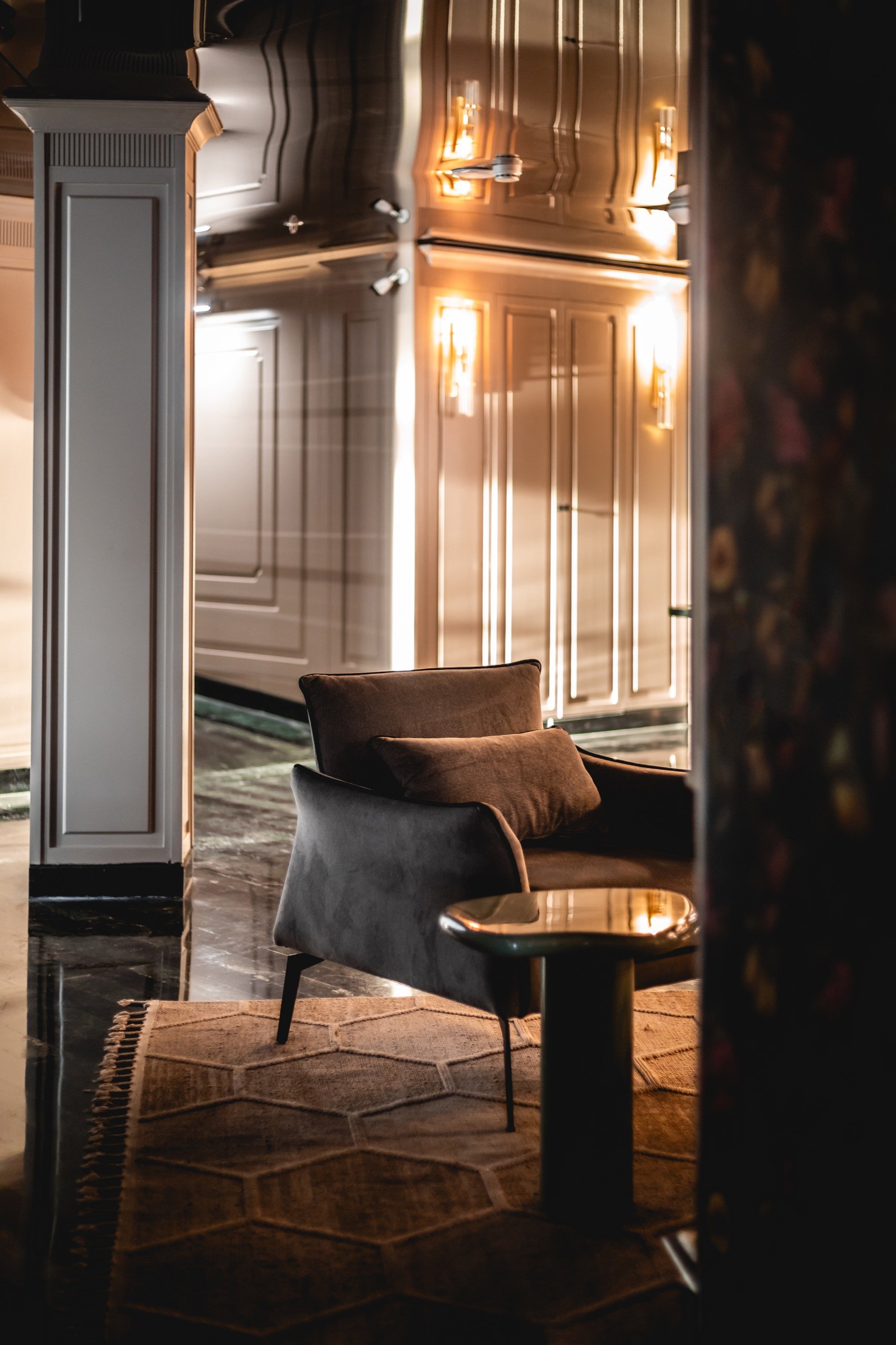 A velvet chair in quiet light.