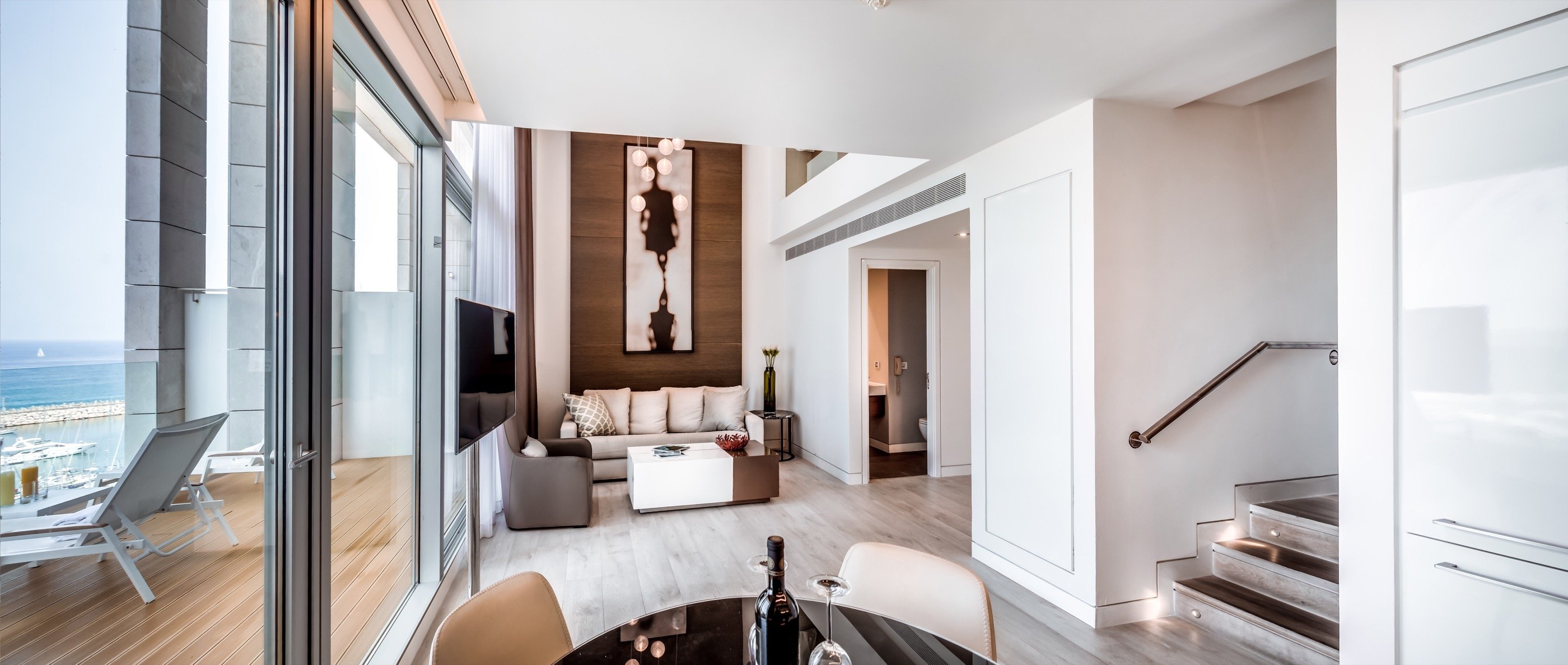 The full living room — sea through the doors.