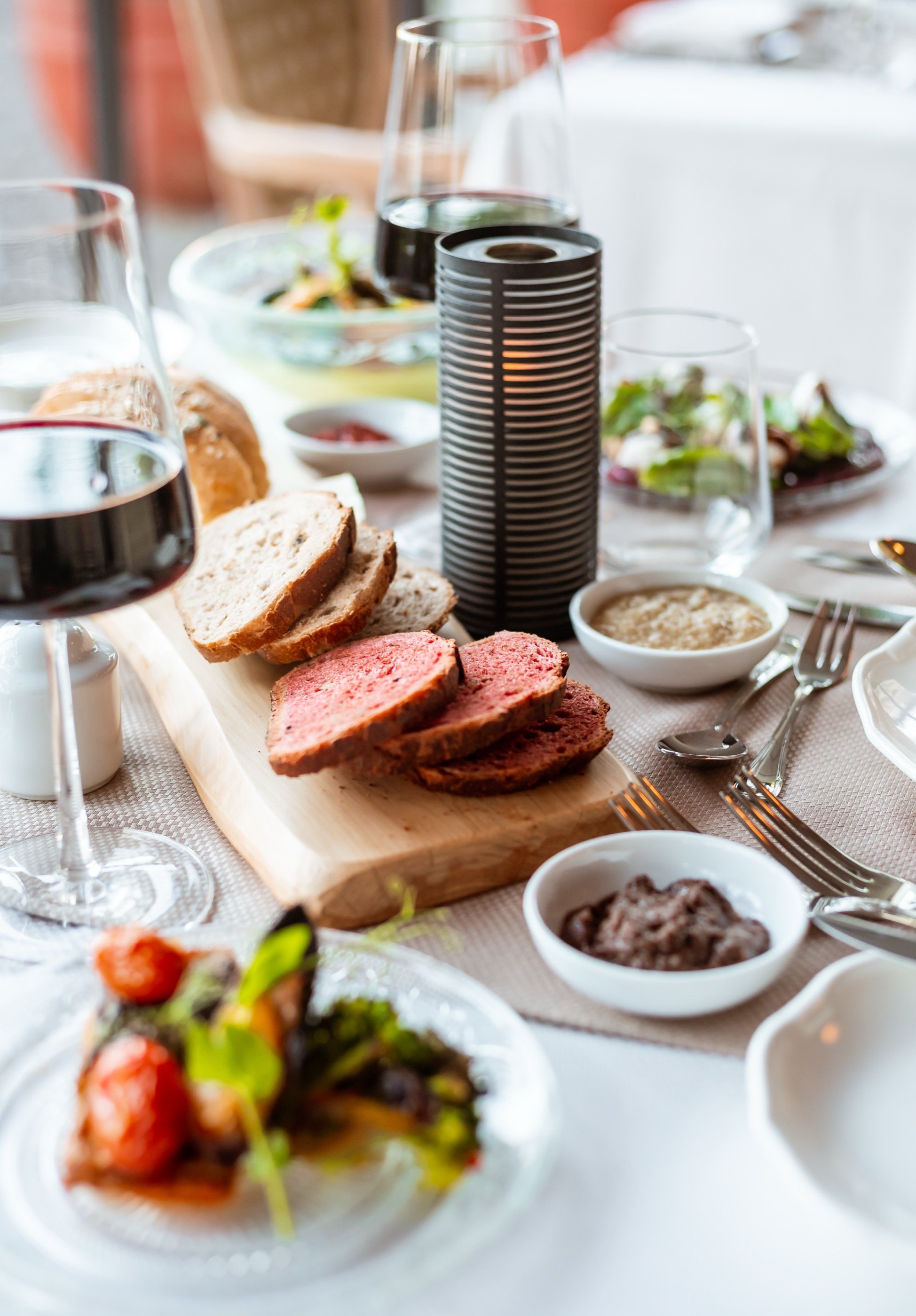 Beef carpaccio and bread.